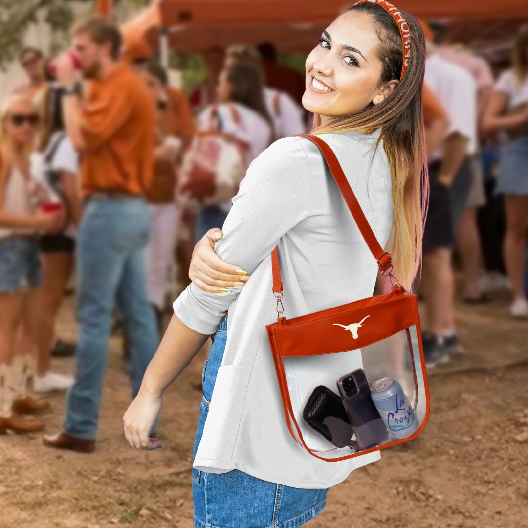 Texas Longhorns fan wearing Texas Longhorn Kate Large Clear Zipper purse at tailgate party 