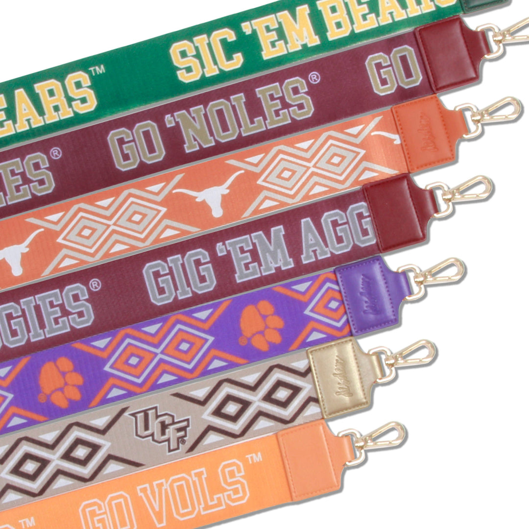 printed purse straps with college logos and brass hardware