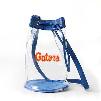 Clear Bucket Bag features vegan leather trim and straps, drawstring closure and stadium approved clear viny material. 